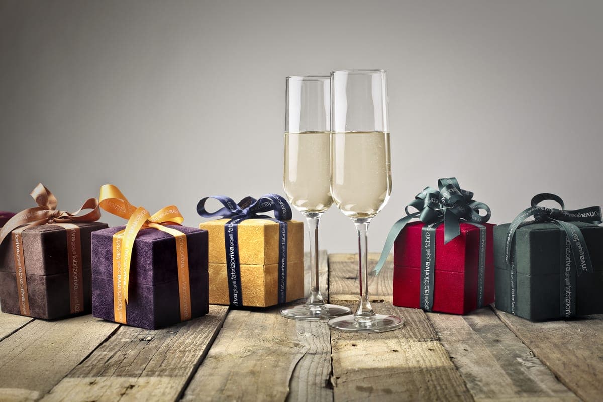 Several wrapped gifts arranged on a wooden table